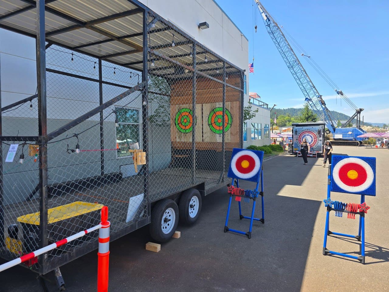 Mobile axe trailer set up for an event with extra targets outside