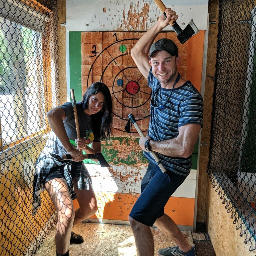 Couple posing with axes at Celtic Axe Throwers