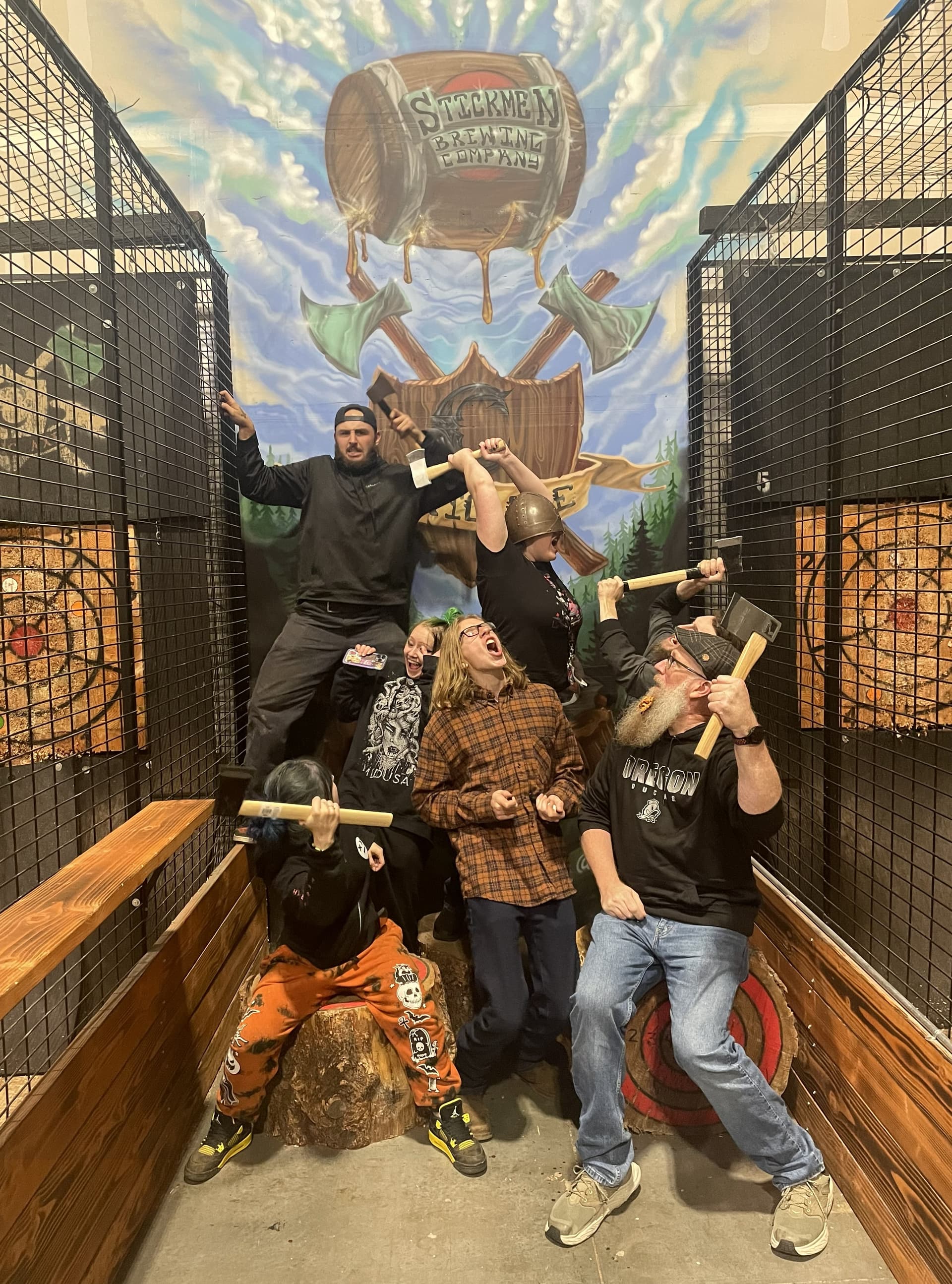 Family group having fun with axes at Celtic Axe