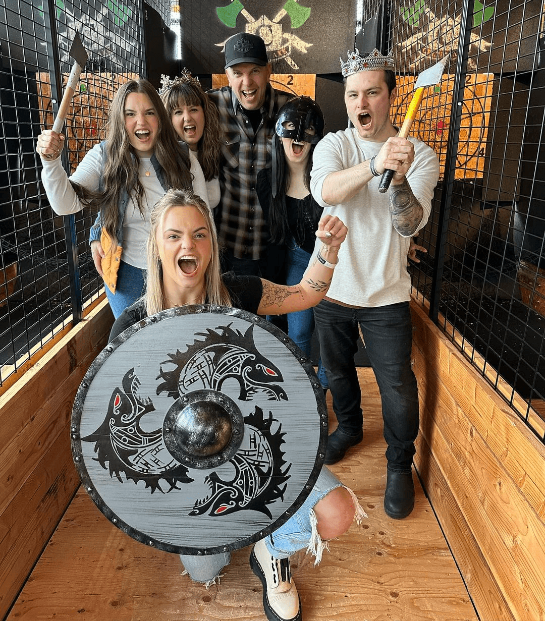 Group celebrating at Celtic Axe with shields and axes