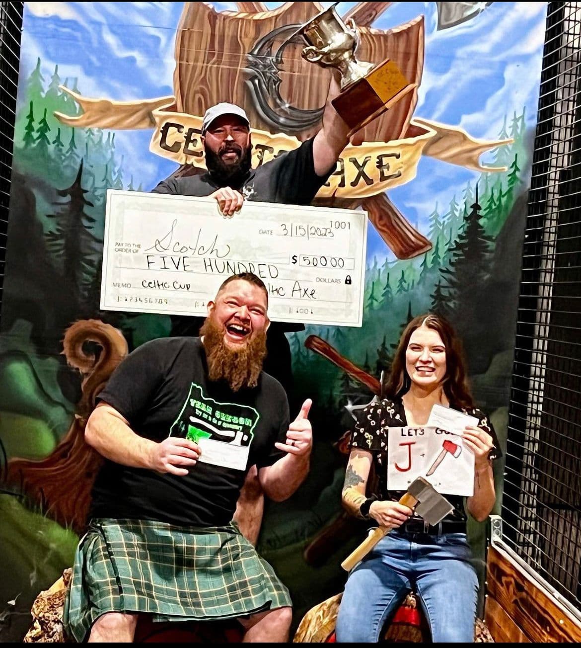 Celtic Cup tournament winners celebrating with trophy and check