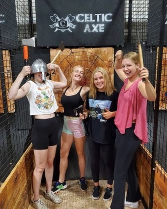 Girls having fun at celtic axe throwers